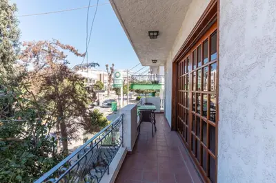 an apartment balcony with a view of a street at AIOLOS LUXURY alimos center Suite II near the sea in Athens