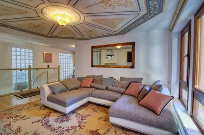 a living room with a couch and a ceiling at Farmaki Residence, Plaka in Athens