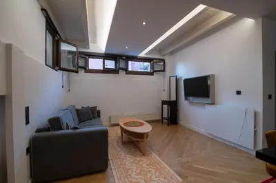 a living room with a couch and a tv at Farmaki Residence, Plaka in Athens