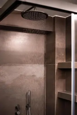 a shower in a bathroom with a shower head at Farmaki Residence, Plaka in Athens