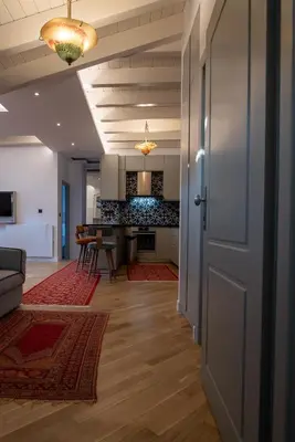 an open door into a living room with a kitchen at Farmaki Residence, Plaka in Athens