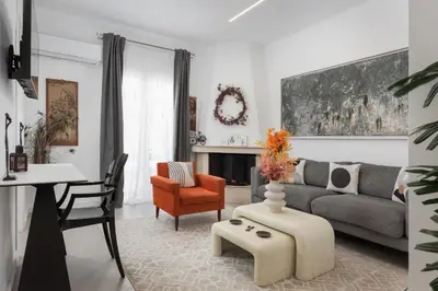 a living room with a couch and a table at Olympian Zeus Residences in Athens