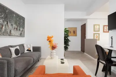 a living room with a couch and a table at Olympian Zeus Residences in Athens