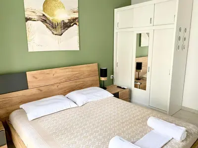 a bedroom with a bed with two towels on it at Athens nice apartment in Athens