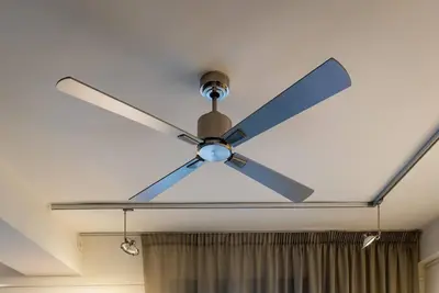 a ceiling fan hanging from a white ceiling at Artistic Spacious Studio Apartment next to metro Monastiraki in Athens