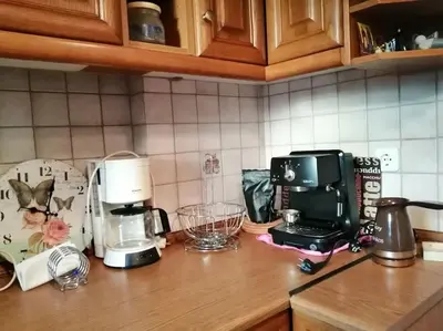 a kitchen counter with a coffee maker and a blender at Cozy studio Maria in Paleo Faliro in Athens