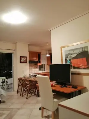 a living room with a desk with a computer on it at Cozy studio Maria in Paleo Faliro in Athens
