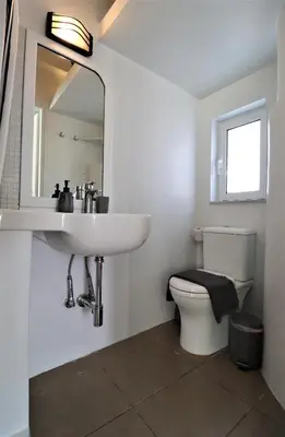 a bathroom with a sink and a toilet at Stunning view private terrace studio @Panormou Metro. in Athens