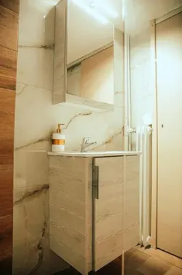 a bathroom with a sink and a mirror at The Sandbox in Athens