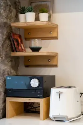 a tv sitting on top of a table with a printer at Efi's DreamSpace in Athens