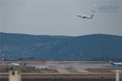 an airplane is taking off from an airport runway at Kalista apartment Airport by Airstay in Spáta