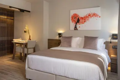a bedroom with a large bed and a table at 507 Athens in Athens