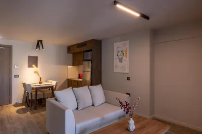 a living room with a couch and a table at 507 Athens in Athens