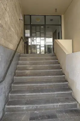 a set of stairs in a building with a lobby at Nice 1BD apartment close to metro station Ampelokipoi in Athens