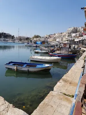 a group of boats are docked in a harbor at Poseidonio in Piraeus
