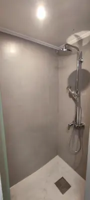 a bathroom with a shower with a shower head at Poseidonio in Piraeus