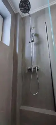 a shower stall in a bathroom with a shower head at Poseidonio in Piraeus