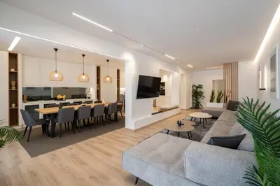 a living room with a couch and a table at Kolonaki Upscale 4 bedroom Luxury Apartment in Athens
