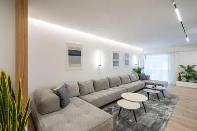 a living room with a couch and a table at Kolonaki Upscale 4 bedroom Luxury Apartment in Athens