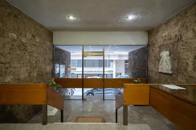 a room with two desks and a large window at Kolonaki Upscale 4 bedroom Luxury Apartment in Athens