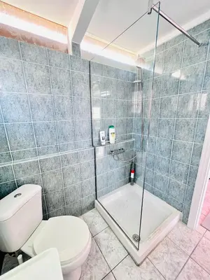 a bathroom with a toilet and a shower at sky inn with wonderful Acropolis view in Neos kosmos in Athens