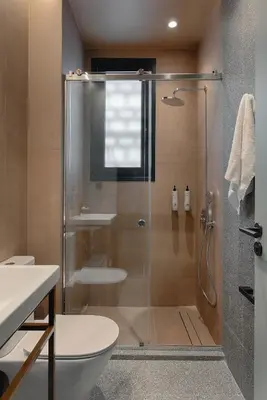 a bathroom with a shower with a toilet and a sink at Evripides Hotel in Athens