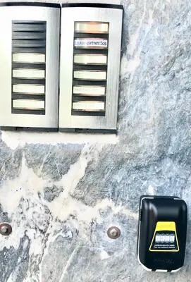 a ashtray sitting on top of a marble floor with a microwave at Lucas apartment 1 in Athens