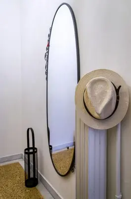 a hat sitting on a shelf next to a mirror at Beautiful 2bd apartment near historic center of Athens in Athens