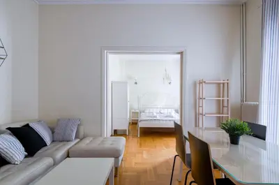 a living room with a couch and a table at Beautiful 2bd apartment near historic center of Athens in Athens