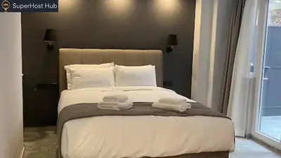 a bedroom with a bed with two towels on it at Monastiraki 112 - 38m2 SuperHost Hub in Athens