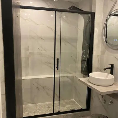 a bathroom with a glass shower with a sink at Monastiraki 112 - 38m2 SuperHost Hub in Athens