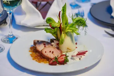 a white plate with food on a table at Crystal City Hotel in Athens