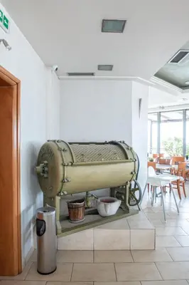 an old sewing machine on display in a room at Athens Golden City Hotel in Athens