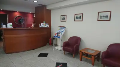a waiting room with two chairs and a counter at Economy Hotel in Athens