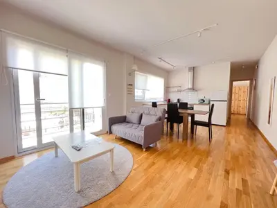 a living room with a couch and a table at Skiathou 12 Contemporary Residences in Athens