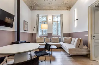 a living room with a couch and a table at Genesis Grande Acropolis Hill Villa in Athens
