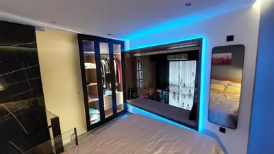 a room with a large mirror and a bed in it at The Athens Loft with private gym and billiards in Athens