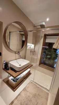 a bathroom with a sink and a mirror at The Athens Loft with private gym and billiards in Athens