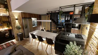 a kitchen with a table and chairs in a room at The Athens Loft with private gym and billiards in Athens