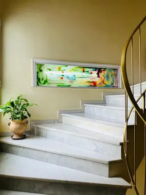 a set of stairs with a potted plant at Triton Hotel Piraeus in Piraeus
