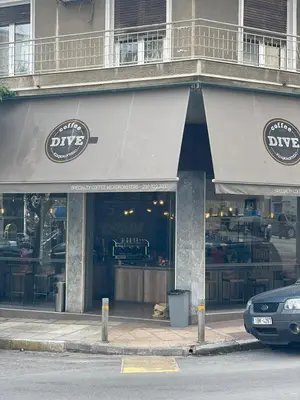 a pizza shop with a car parked in front of it at Acropolis selected apartment in Athens