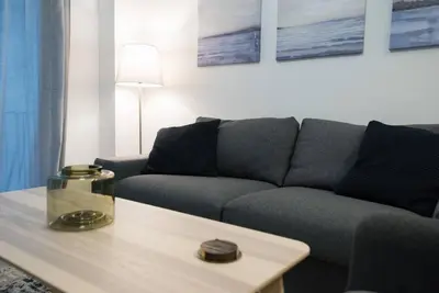 a living room with a couch and a coffee table at Acropolis selected apartment in Athens