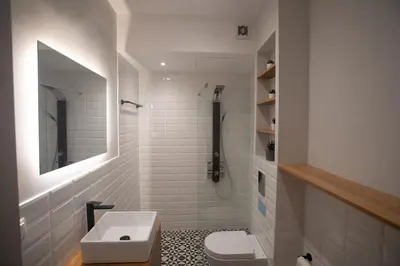 a white bathroom with a sink and a toilet at Acropolis Vibes Apartments in Athens