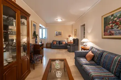 a living room with a couch and a table at 2 BR Apartment 5 minutes to Thissio Metro & Acropolis in Athens