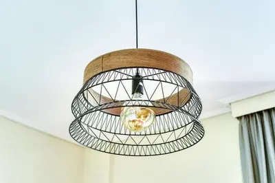 aendant light hanging from a ceiling in a room at Escape with Style in this Chic 2BR Apartment! in Athens