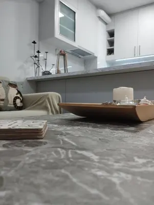 a kitchen with a counter top with a table at Renovated Basement Duplex with Patio and Folk Decor in the Heart of Athens in Athens