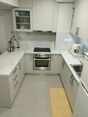 a kitchen with white counters and a stove top oven at Renovated Basement Duplex with Patio and Folk Decor in the Heart of Athens in Athens