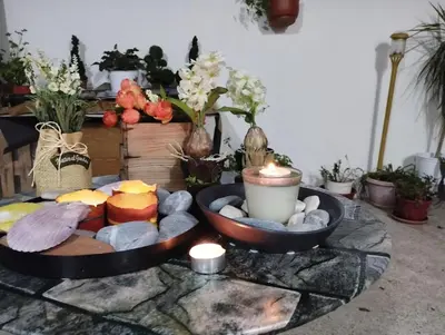 a table with a tray of food and candles on it at Renovated Basement Duplex with Patio and Folk Decor in the Heart of Athens in Athens