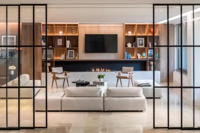 a living room with a couch and a fireplace at Amarilia Hotel in Athens