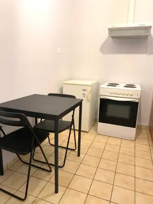 a kitchen with a black table and a stove at Athens City Themis 9 in Athens